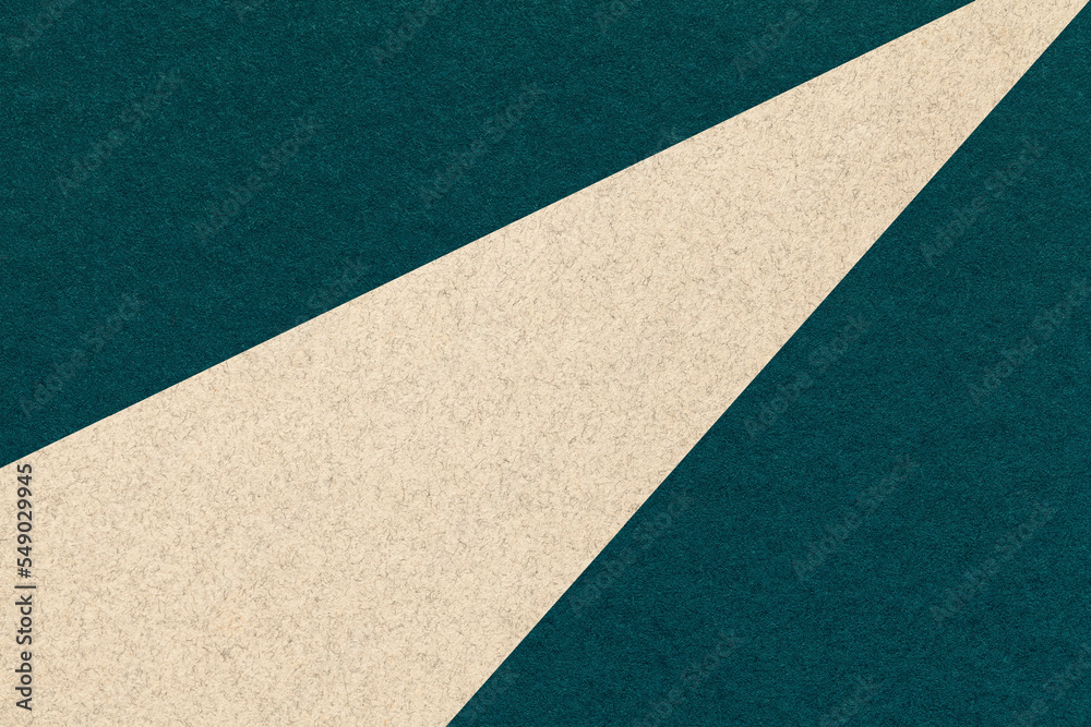 Texture of old craft dark emerald color paper background with beige line, macro. Vintage abstract green cardboard Texture of old craft dark emerald color paper background with beige line, macro. Vintage abstract green cardboard