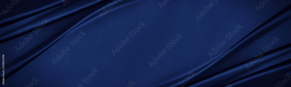 Navy blue silk satin. Silky shiny fabric. Dark luxury background with space for design. Banner. Wide. Long. Panoramic. Template. Empty. Flat lay, top view table. Beautiful.Elegant.Birthday,Christmas.