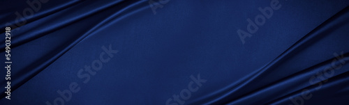 Obraz na płótnie Navy blue silk satin. Silky shiny fabric. Dark luxury background with space for design. Banner. Wide. Long. Panoramic. Template. Empty. Flat lay, top view table. Beautiful.Elegant.Birthday,Christmas. w salonie