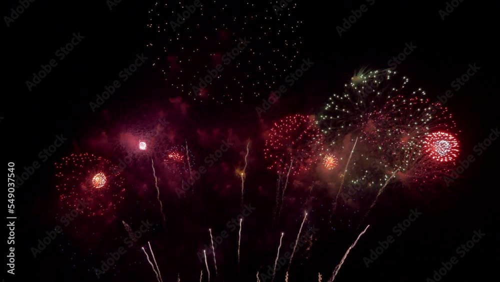 Amazing beautiful colorful firework display over sea on celebration night. Fireworks show for happy new year	