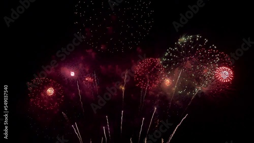Amazing beautiful colorful firework display over sea on celebration night. Fireworks show for happy new year	