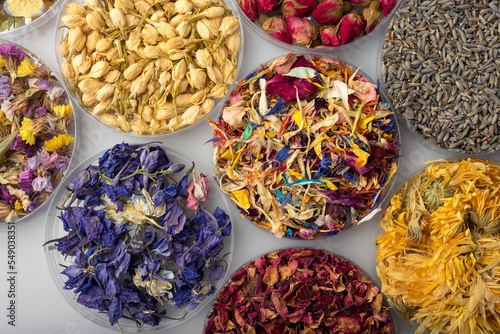 natural dried edible and pressed flowers for decorative use in pastry and cocktails with a variety of colors and shapes photo