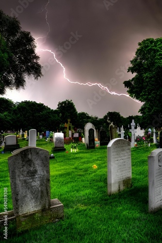 Unexplainable thunderstorm in a graveyard.