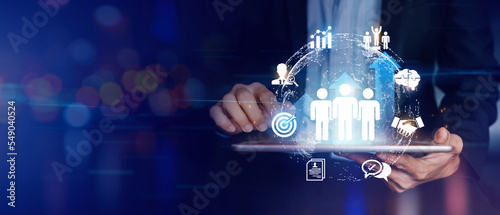 Fotografie Businessman hold circle of network structure HR - Human resources web banner with copy space
