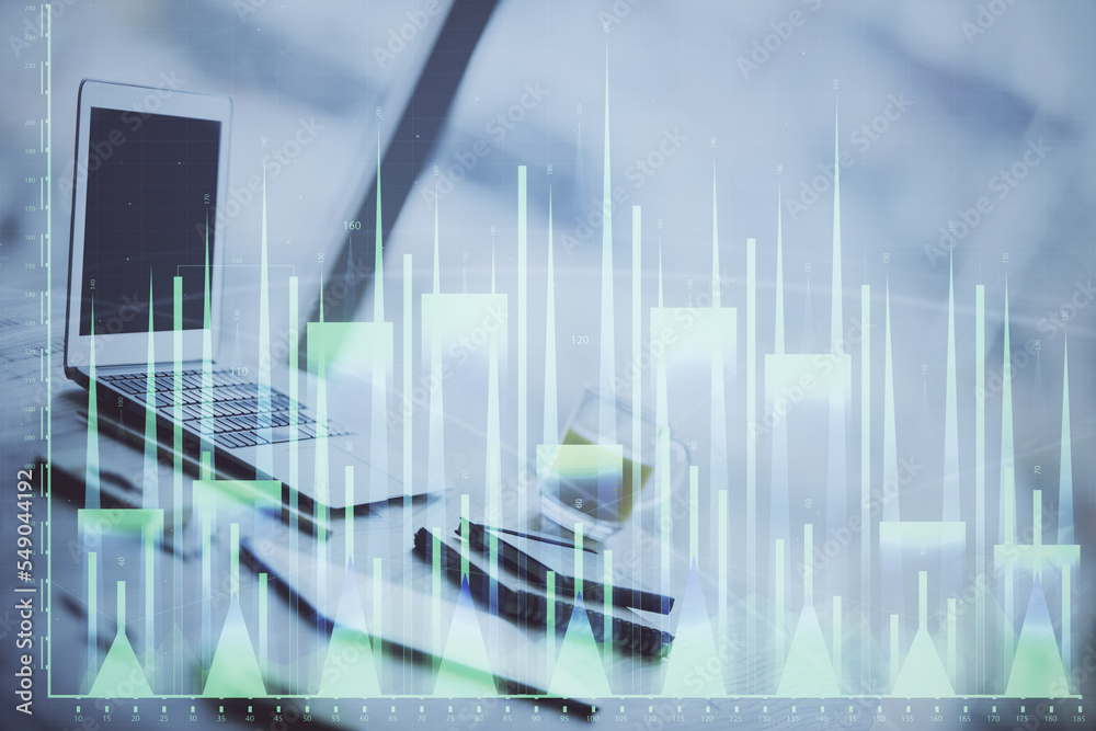 Forex graph hologram on table with computer background. Multi exposure. Concept of financial markets. Forex graph hologram on table with computer background. Multi exposure. Concept of financial markets.