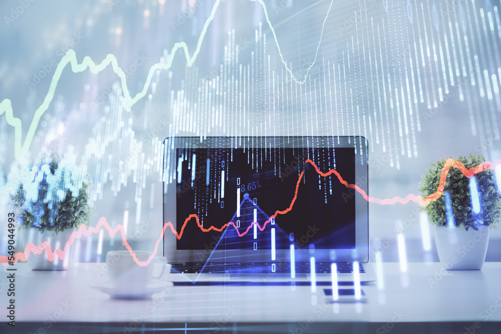 Forex graph hologram on table with computer background. Multi exposure. Concept of financial markets. Forex graph hologram on table with computer background. Multi exposure. Concept of financial markets.