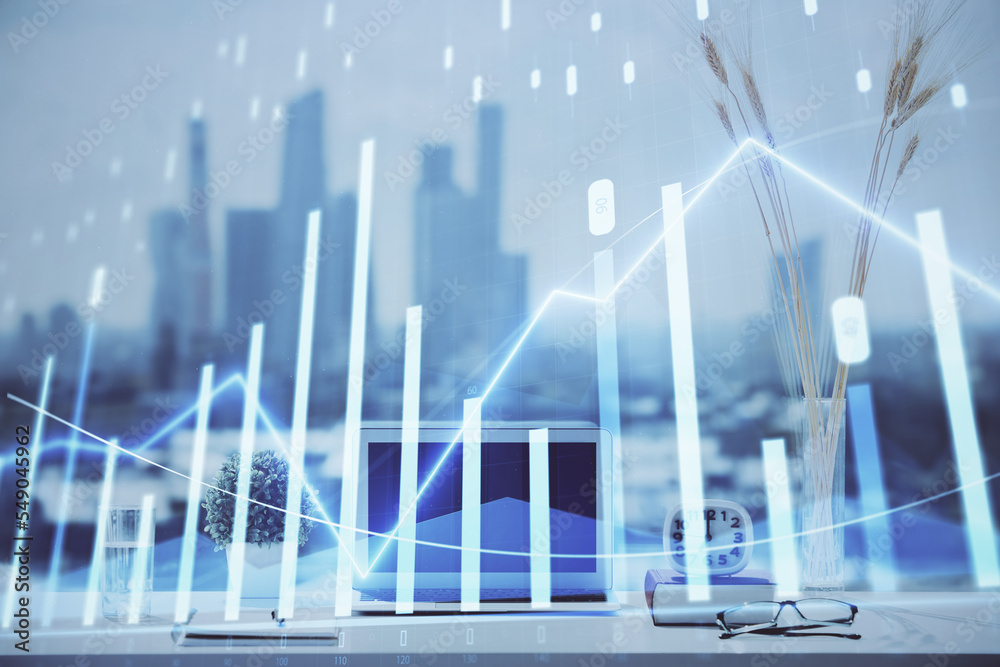 Forex graph hologram on table with computer background. Multi exposure. Concept of financial markets. Forex graph hologram on table with computer background. Multi exposure. Concept of financial markets.
