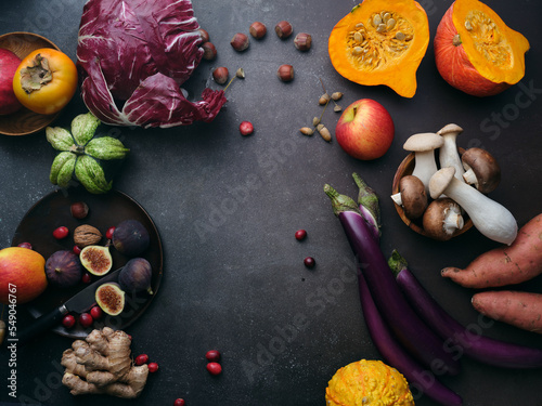 Top view winter groceries, healthy vegetarian ingredients for cooking a dinner on a dark background