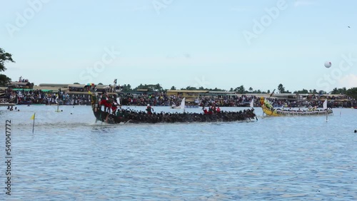 Snake Boat races of Kerala. People in traditional dress rowing the snake boats in Alleppey Aranmula boat race in Kerala, India.