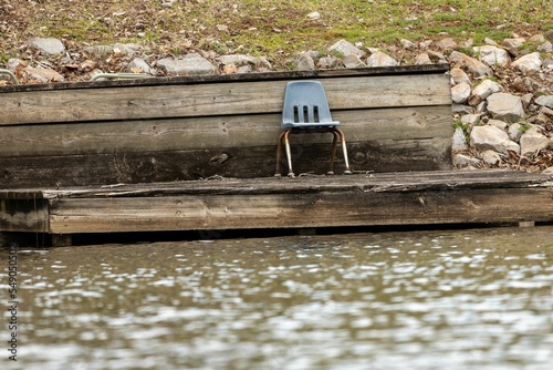 Closeup shot of a small chair on the dock in Louisiana, USA