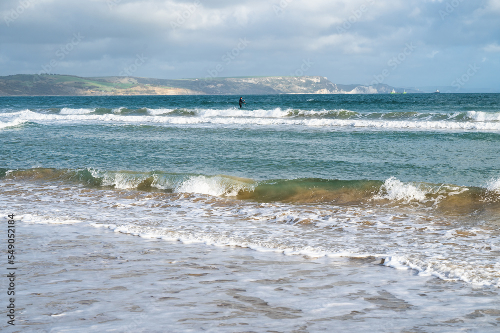 Seaside town of Weymouth in Dorset, United Kingdom. View of the waves in the sea, selective focus