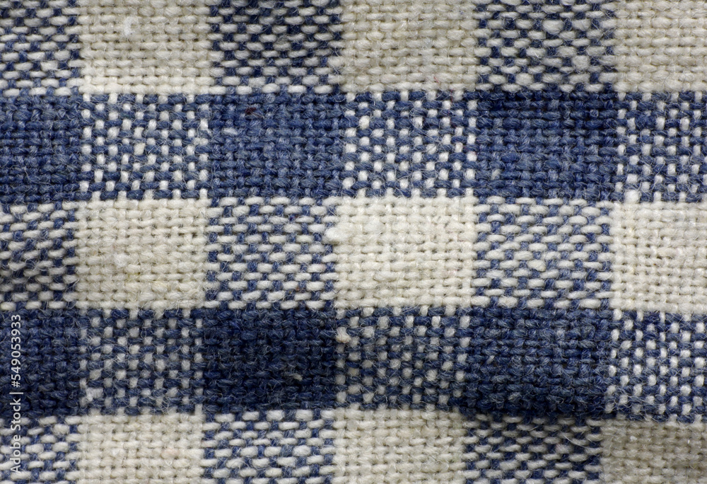 close-up of a white and blue checkered tablecloth close-up of a white and blue checkered tablecloth