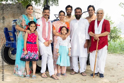 Photography Group of rural people with senior man at village home.