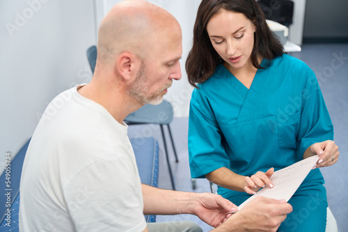 Nurse is sitting close to patient during appointment discussion