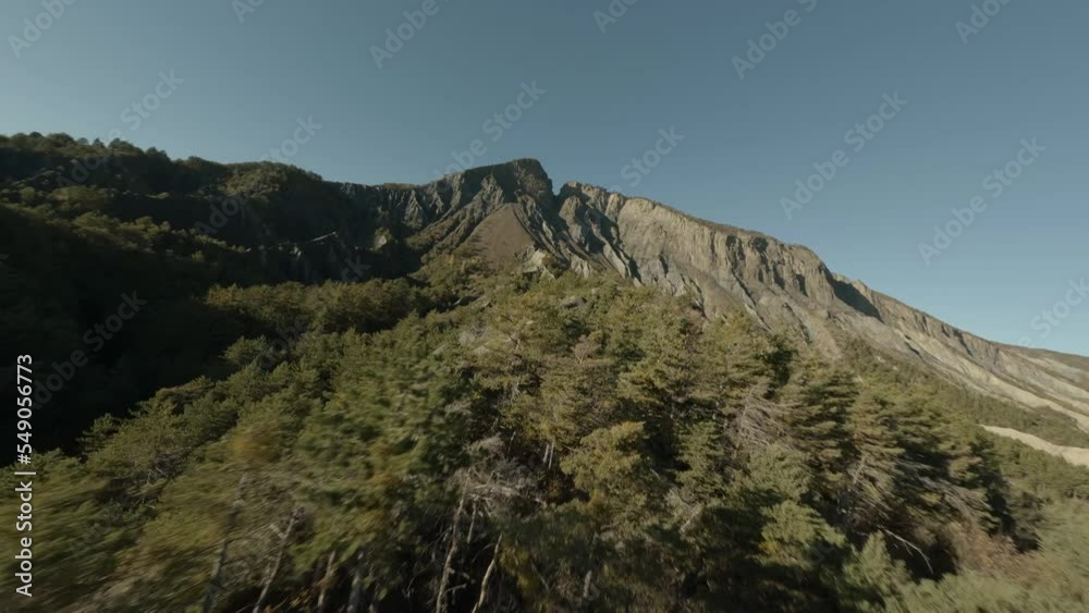 Massive of La Viste, flies in a dynamic FPV drone along geological formation with a rocky panorama exploration of the natural environment Massive of La Viste, flies in a dynamic FPV drone along geological formation with a rocky panorama exploration of the natural environment