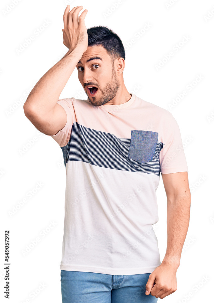 Young handsome man wearing casual clothes surprised with hand on head for mistake, remember error. forgot, bad memory concept. Young handsome man wearing casual clothes surprised with hand on head for mistake, remember error. forgot, bad memory concept.