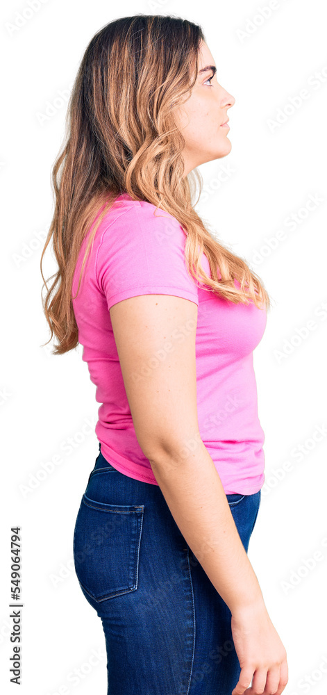 Young caucasian woman wearing sportswear looking to side, relax profile pose with natural face with confident smile. Young caucasian woman wearing sportswear looking to side, relax profile pose with natural face with confident smile.