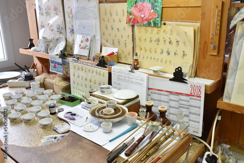 Authentic porcelain production in the Porcelain Manufactory Meissen. Various tools - brushes and colourful pigments.