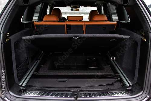 Huge, clean and empty car trunk in interior of compact suv. Rear view of a SUV car with open trunk