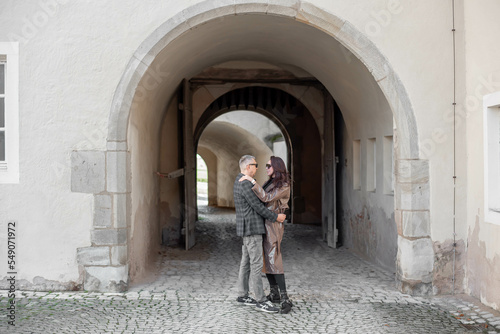 love story of a loving couple.a couple - a girl and a guy walk and hug near the arch © александр таланцев