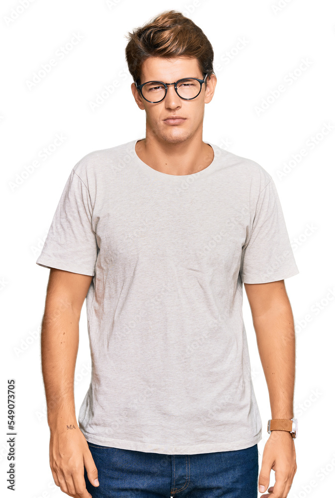 Handsome caucasian man wearing casual clothes and glasses looking sleepy and tired, exhausted for fatigue and hangover, lazy eyes in the morning. Handsome caucasian man wearing casual clothes and glasses looking sleepy and tired, exhausted for fatigue and hangover, lazy eyes in the morning.