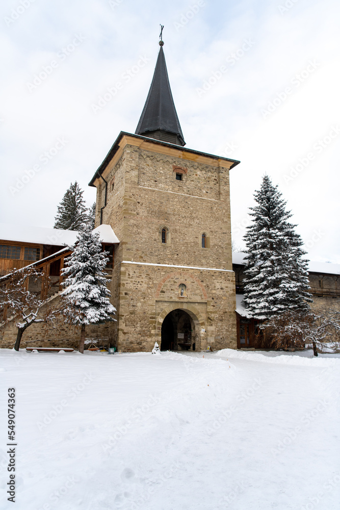 Sucevita, Romania, 2021-12-29. Sucevita Monastery in the Bukovina region under the snow. Their exterior walls are composed of frescoes painted in the 15th and 16th centuries, representing portraits of