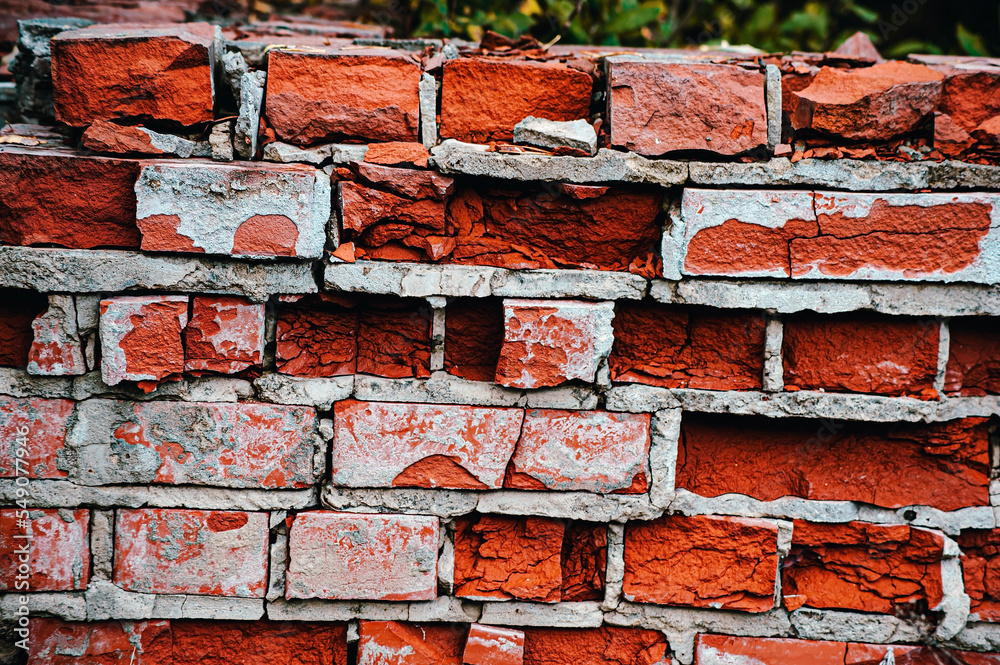 old red and yellow bricks on the wall texture with pieces of plaster and paint. old red and yellow bricks on the wall texture with pieces of plaster and paint.