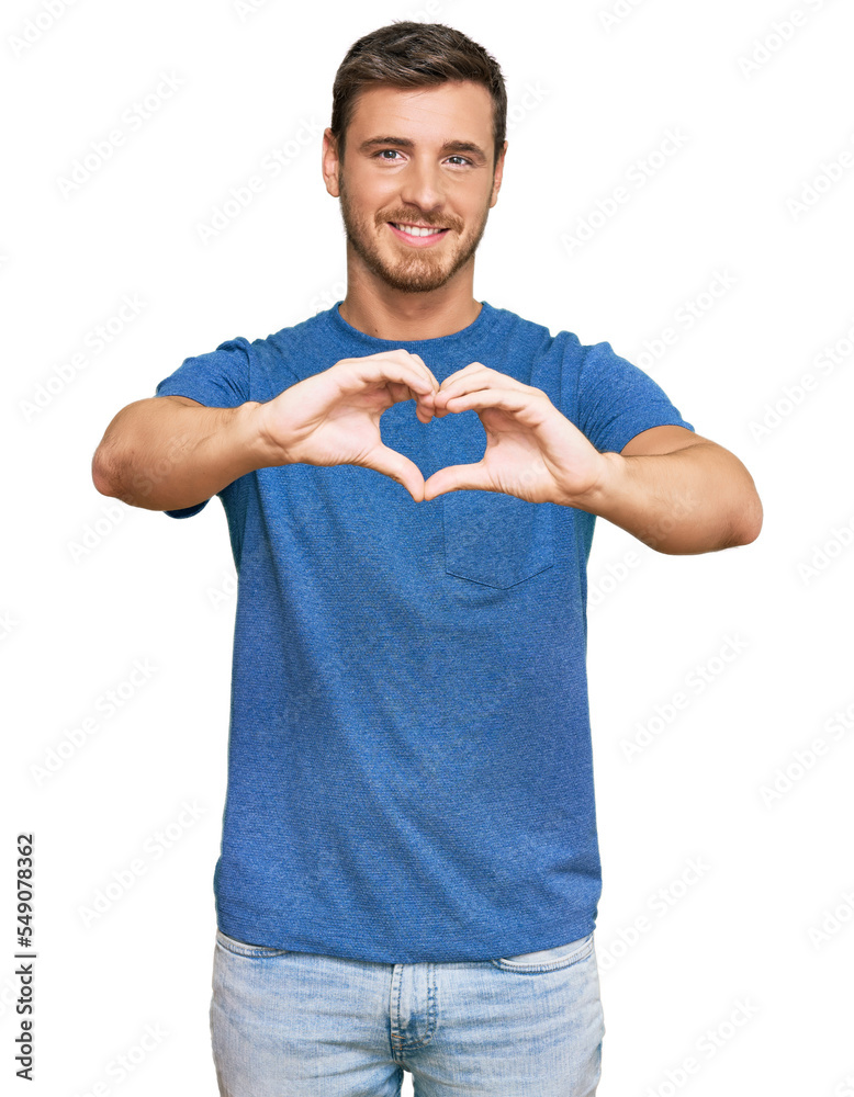 Handsome caucasian man wearing casual clothes smiling in love doing heart symbol shape with hands. romantic concept. Handsome caucasian man wearing casual clothes smiling in love doing heart symbol shape with hands. romantic concept.
