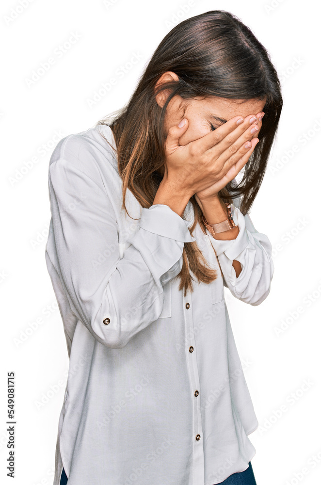 Young beautiful woman wearing casual clothes with sad expression covering face with hands while crying. depression concept. Young beautiful woman wearing casual clothes with sad expression covering face with hands while crying. depression concept.