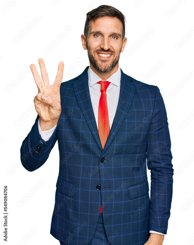 Handsome man with beard wearing business suit and tie showing and pointing up with fingers number three while smiling confident and happy. Handsome man with beard wearing business suit and tie showing and pointing up with fingers number three while smiling confident and happy.