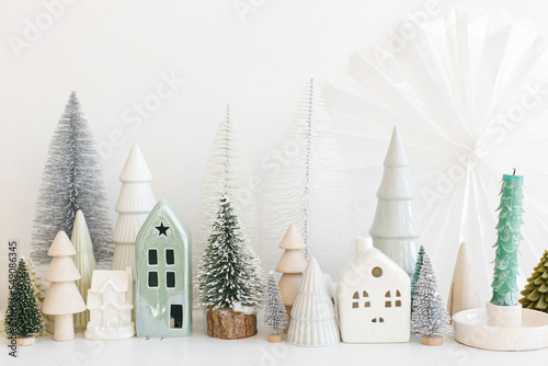 Fotografiet Merry Christmas and Happy Holidays! Modern christmas scene, miniature cozy snowy village