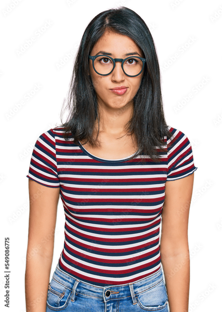 Beautiful asian young woman wearing casual clothes and glasses skeptic and nervous, frowning upset because of problem. negative person.