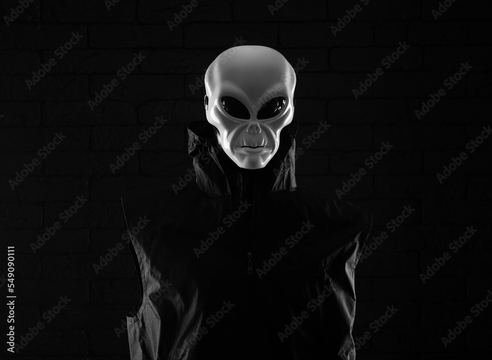 portrait of an alien on a black background portrait of an alien on a black background