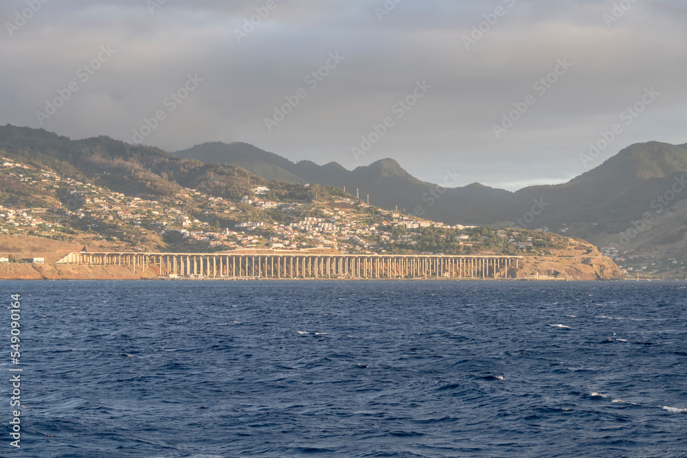 urban sprawl and airport bridge runway on shore at Santa Cruz, Madeira
