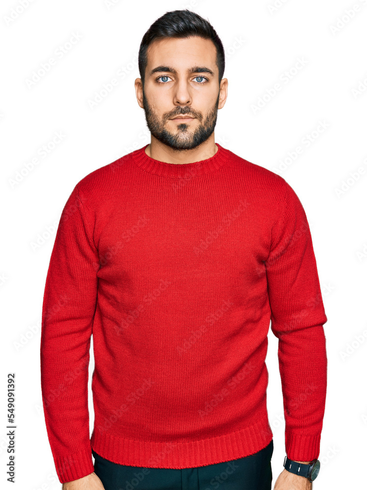 Young hispanic man wearing casual clothes relaxed with serious expression on face. simple and natural looking at the camera.