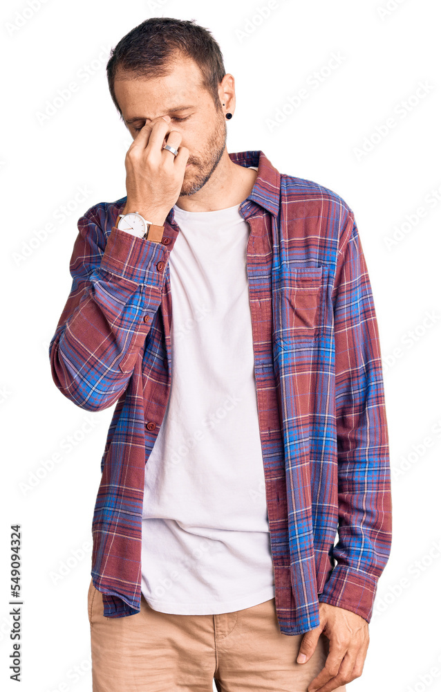 Young handsome man wearing casual clothes tired rubbing nose and eyes feeling fatigue and headache. stress and frustration concept.