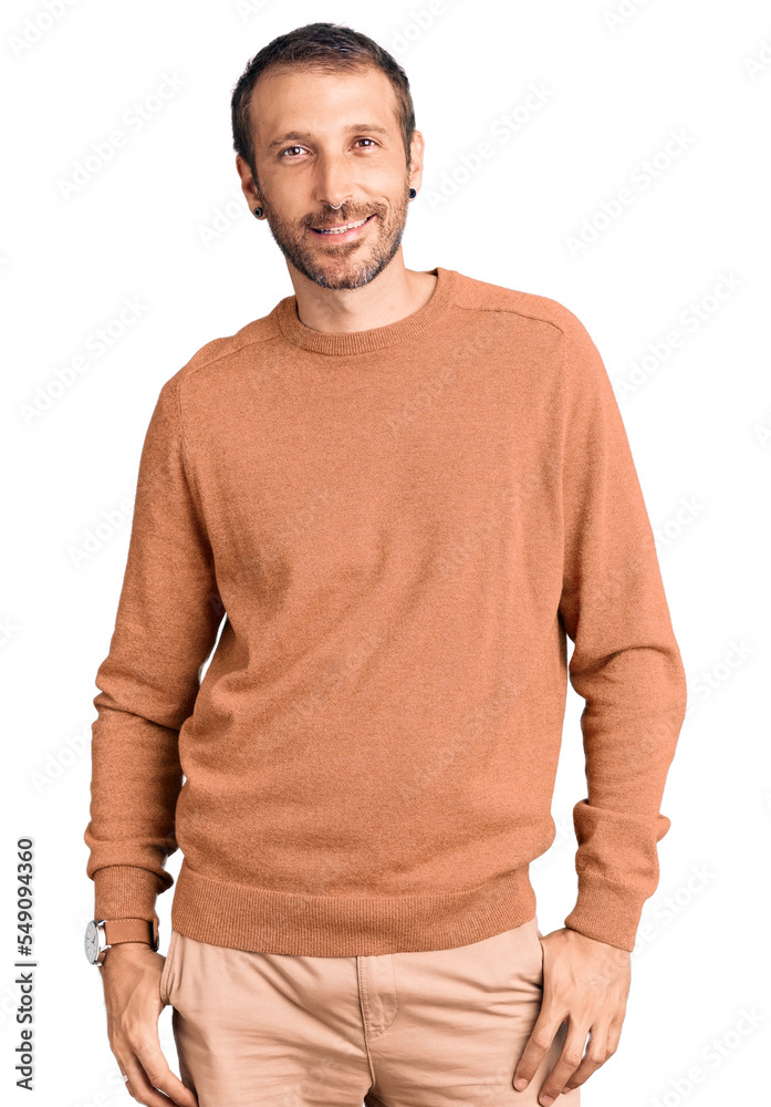 Young handsome man wearing casual clothes looking away to side with smile on face, natural expression. laughing confident. Young handsome man wearing casual clothes looking away to side with smile on face, natural expression. laughing confident.