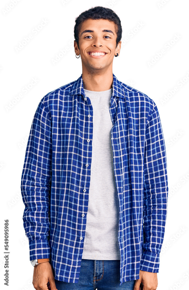 Young african amercian man wearing casual clothes with a happy and cool smile on face. lucky person. Young african amercian man wearing casual clothes with a happy and cool smile on face. lucky person.