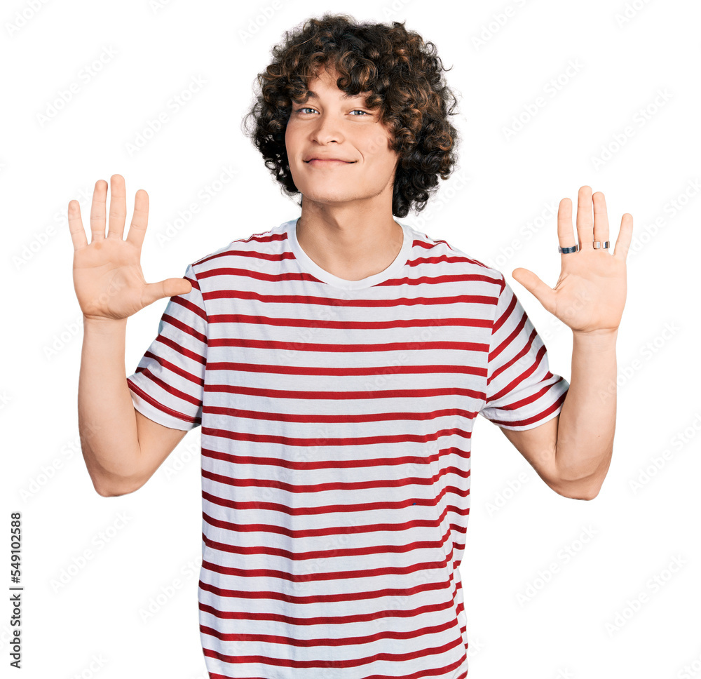 Caucasian teenager wearing casual clothes showing and pointing up with fingers number ten while smiling confident and happy.
