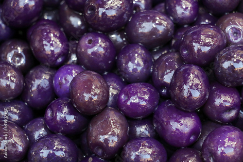 purple olives marinated with blueberries and flavored