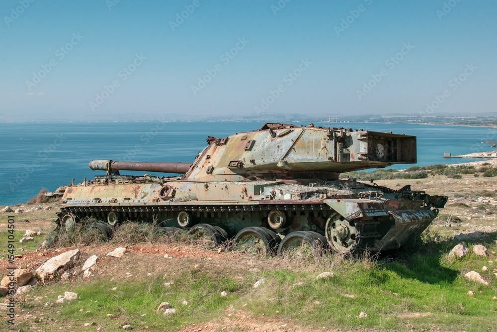 Fototapeta premium Old, destroyed tank in Cyprus. Military compound on the coast. 