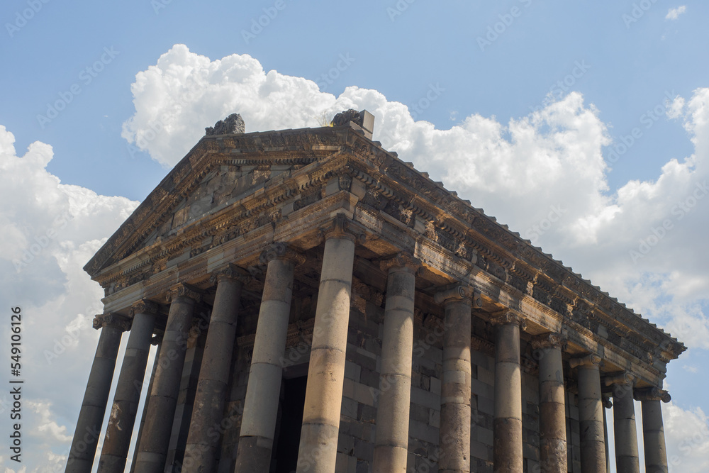 Fototapeta premium The temple in Garni , a pagan temple in Armenia, built in the I century AD. Facade with a classic colonnade on the background of sky