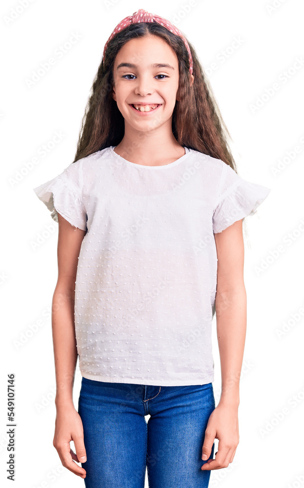 Cute hispanic child girl wearing casual white tshirt with a happy and cool smile on face. lucky person. Cute hispanic child girl wearing casual white tshirt with a happy and cool smile on face. lucky person.