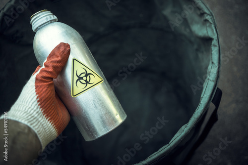 A bottle of toxic waste in your hand. Disposal of nuclear fuel waste. Release of charged substances.Hazardous waste.