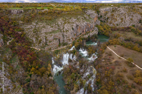 The tallest waterfall in Krka national park. Manojlovac waterfall or Manojlovački slapovi in autumn, Croatia.  photo