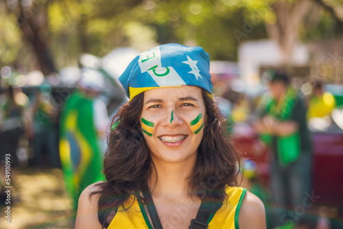 brazilian girl smiling with flag of brazil