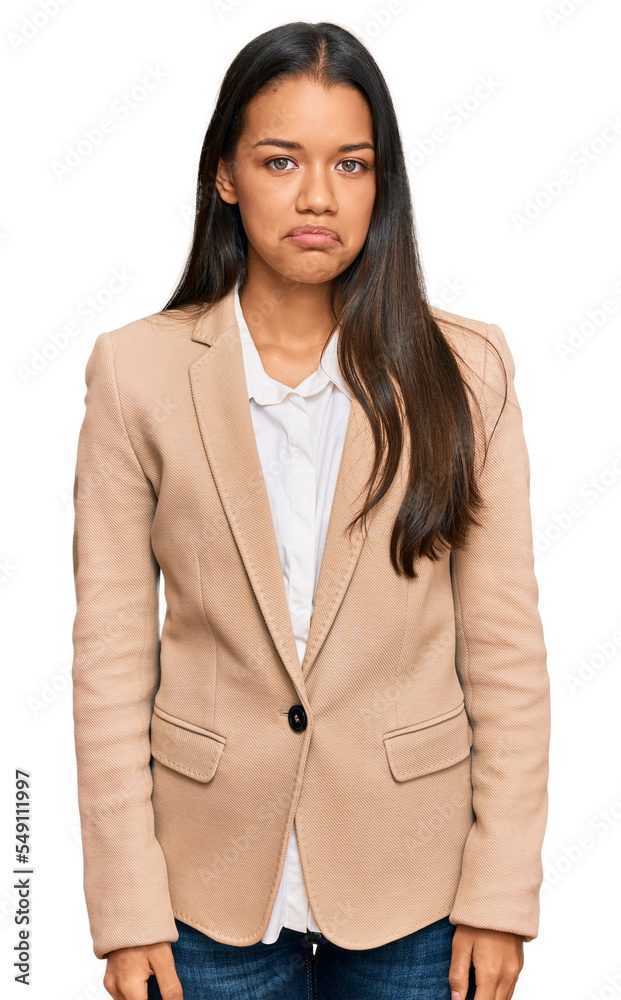 Beautiful hispanic woman wearing business jacket depressed and worry for distress, crying angry and afraid. sad expression. Beautiful hispanic woman wearing business jacket depressed and worry for distress, crying angry and afraid. sad expression.