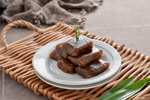 Jenang Ketan Dodol Wijen, Made from glutinous rice flour, coconut milk, brown sugar and pandan leaves, then add sesame seeds. Typical Banyumas snack have a sweet taste, popular with name Jenang Jaket. photo