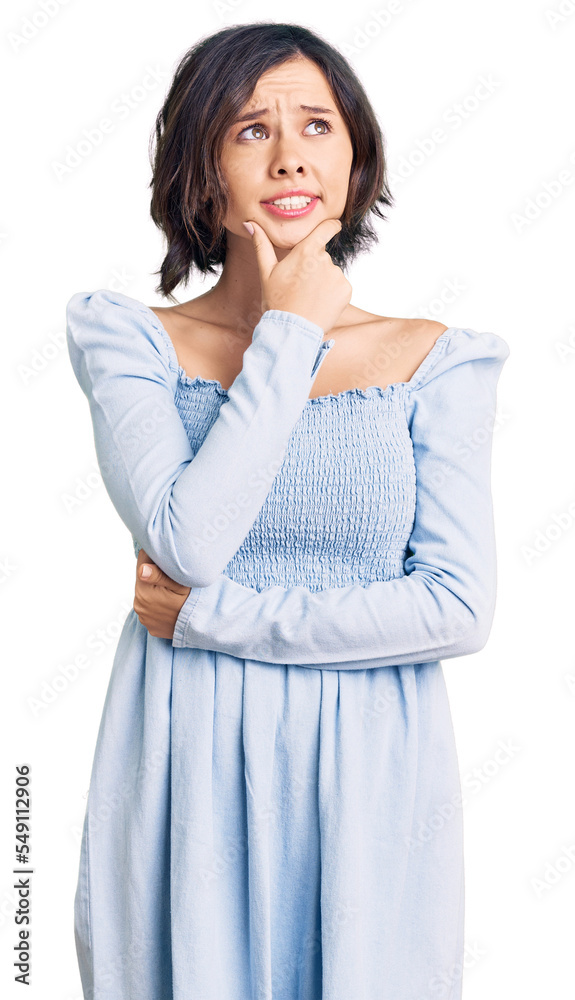 Young beautiful girl wearing casual clothes thinking worried about a question, concerned and nervous with hand on chin Young beautiful girl wearing casual clothes thinking worried about a question, concerned and nervous with hand on chin