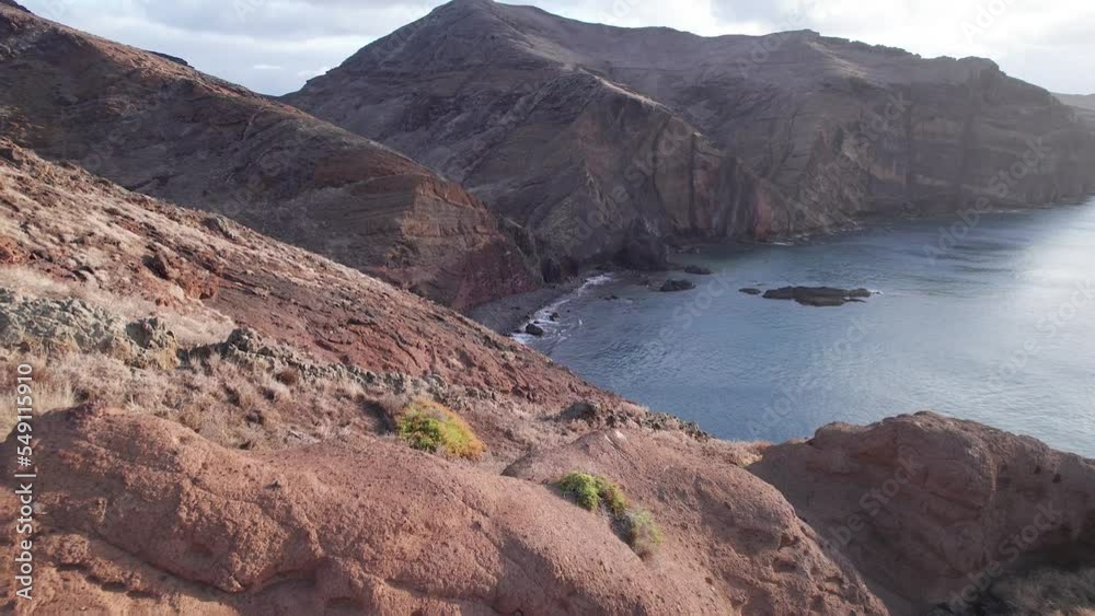 Drone flying over a cliff in the mountains on the island of Madeira in Portugal Drone flying over a cliff in the mountains on the island of Madeira in Portugal
